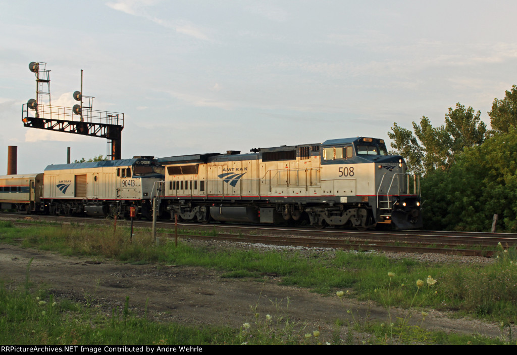 A rare "doubleheaded" Hiawatha glides past in the evening light